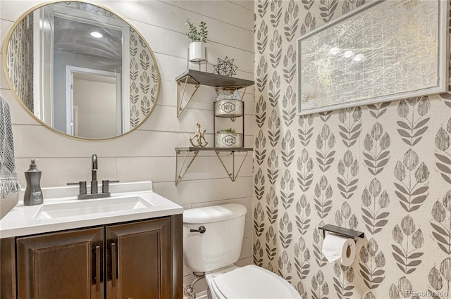 1410 Old Sequoia Ct, Franktown, CO 80116 - half bathroom with tile walls, toilet, and vanity