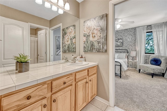 1410 Old Sequoia Ct, Franktown, CO 80116 - ensuite bathroom featuring vanity, ceiling fan, and tile patterned floors