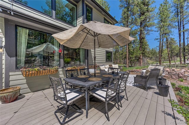 1410 Old Sequoia Ct, Franktown, CO 80116 - deck with outdoor dining area