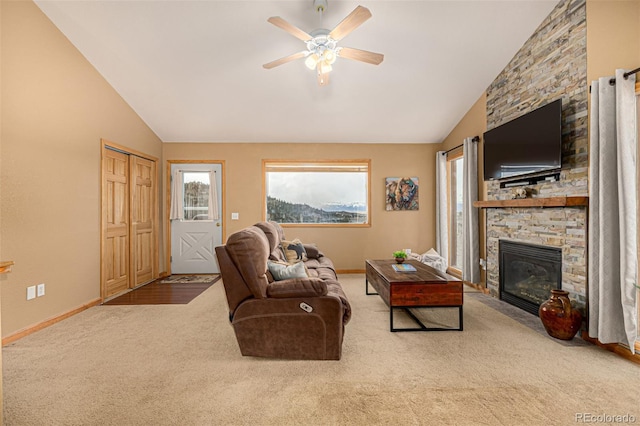 2418 Wells Fargo Cir, Jefferson, CO 80456 - living area with lofted ceiling, ceiling fan, carpet, a fireplace, and baseboards