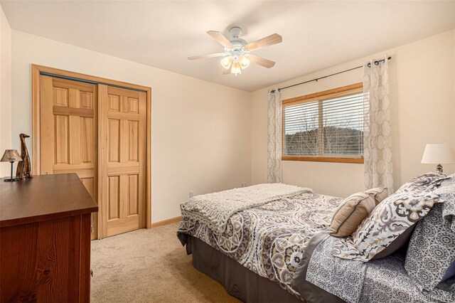 2418 Wells Fargo Cir, Jefferson, CO 80456 - carpeted bedroom featuring a closet, ceiling fan, and baseboards