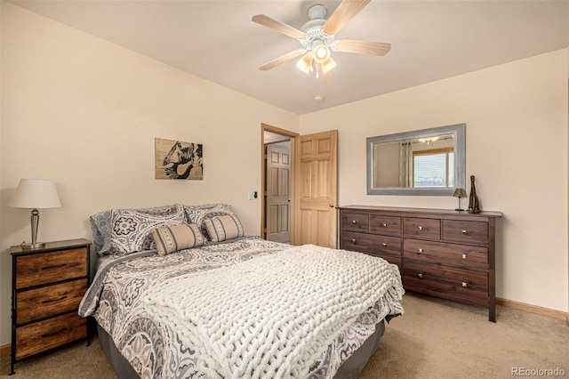 2418 Wells Fargo Cir, Jefferson, CO 80456 - bedroom with light colored carpet, baseboards, and ceiling fan