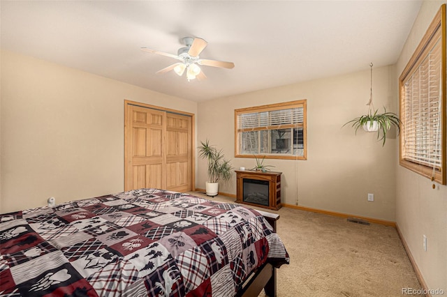 2418 Wells Fargo Cir, Jefferson, CO 80456 - bedroom with carpet, a closet, baseboards, and a ceiling fan