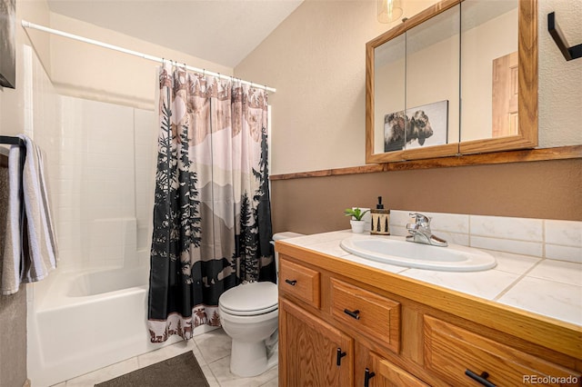 2418 Wells Fargo Cir, Jefferson, CO 80456 - full bath featuring toilet, vanity, shower / tub combo, tile patterned floors, and a textured wall