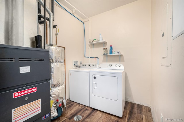 2418 Wells Fargo Cir, Jefferson, CO 80456 - laundry area featuring washer and clothes dryer, wood finished floors, and heating unit