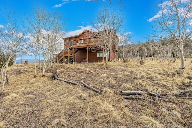 2418 Wells Fargo Cir, Jefferson, CO 80456 - rear view of house featuring a deck and stairs