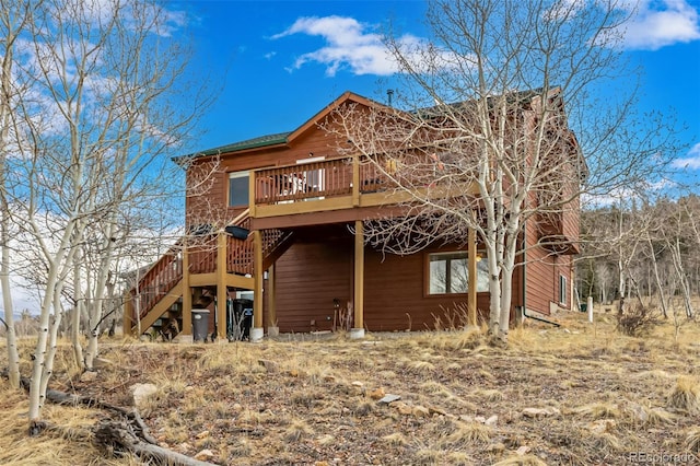 2418 Wells Fargo Cir, Jefferson, CO 80456 - back of house with a deck and stairway