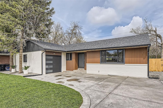 920 S Hudson St, Denver, CO 80246 - view of front of property featuring brick siding, a shingled roof, a garage, and driveway