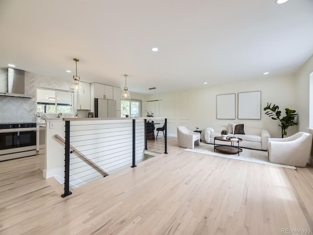 920 S Hudson St, Denver, CO 80246 - living room with light wood-type flooring and recessed lighting