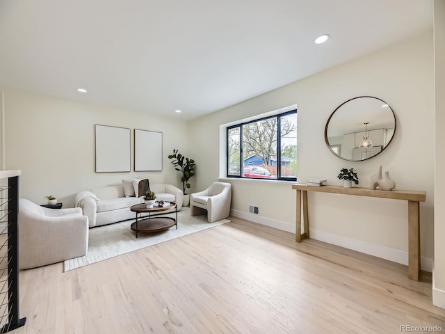 920 S Hudson St, Denver, CO 80246 - living area featuring wood finished floors, baseboards, and recessed lighting