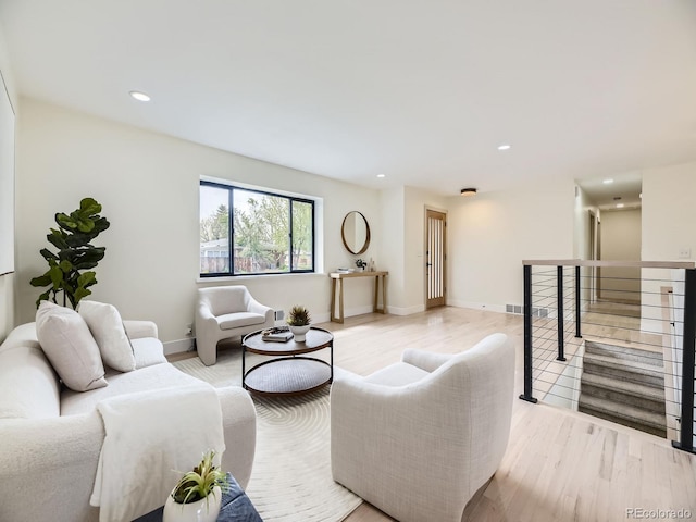 920 S Hudson St, Denver, CO 80246 - living area with light wood-style flooring, recessed lighting, baseboards, and stairway