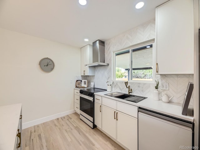 920 S Hudson St, Denver, CO 80246 - kitchen featuring wall chimney range hood, electric range oven, dishwashing machine, a sink, and white cabinetry