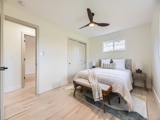920 S Hudson St, Denver, CO 80246 - bedroom featuring light wood-style floors, a closet, baseboards, and ceiling fan