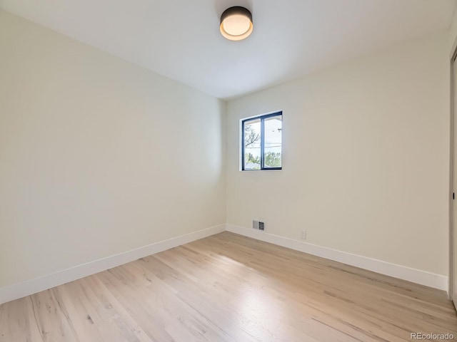 920 S Hudson St, Denver, CO 80246 - spare room featuring baseboards and light wood finished floors
