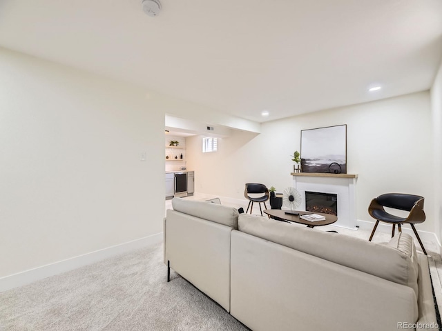 920 S Hudson St, Denver, CO 80246 - living area featuring baseboards, a glass covered fireplace, light carpet, and recessed lighting