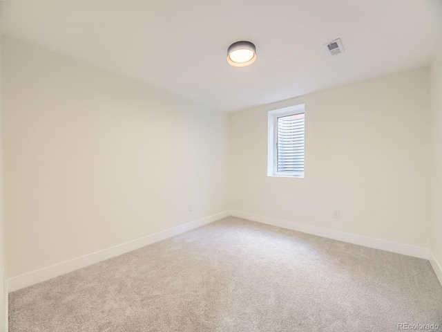 920 S Hudson St, Denver, CO 80246 - spare room featuring baseboards and light carpet