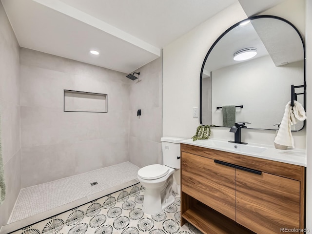 920 S Hudson St, Denver, CO 80246 - full bath with vanity, tiled shower, toilet, and tile patterned flooring
