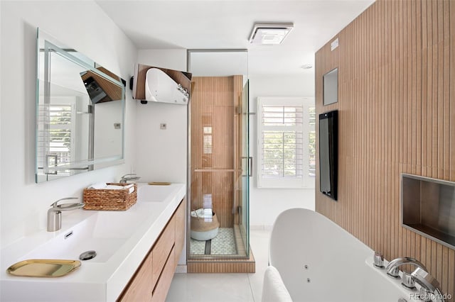 full bathroom featuring a tub with jets, a stall shower, plenty of natural light, and vanity