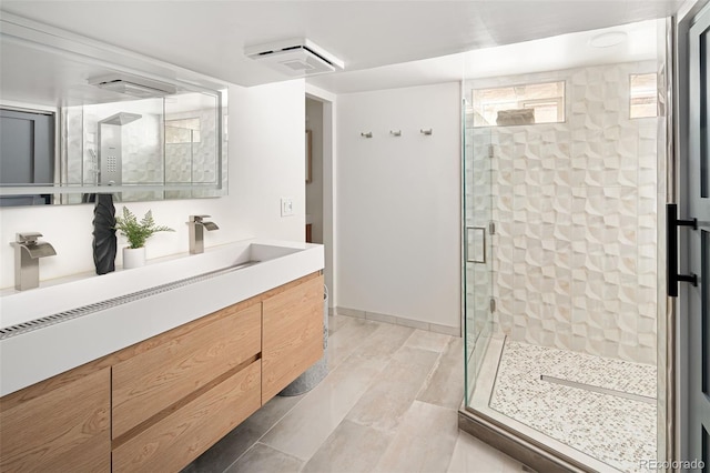 full bathroom featuring a shower stall and vanity