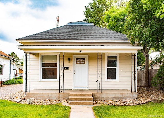 111 Douglas St, Sterling, CO 80751 - view of front of property with a porch and a shingled roof