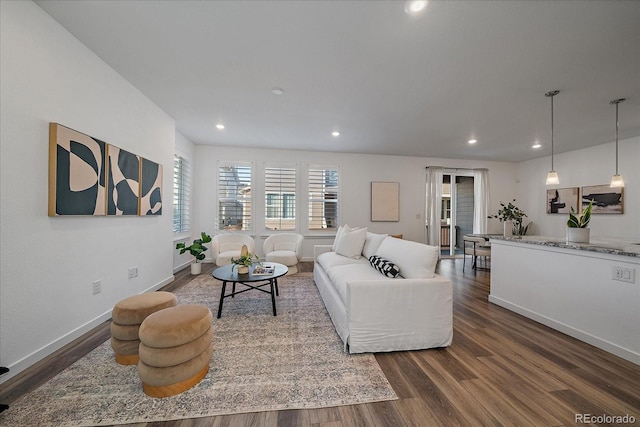 living room featuring dark wood-style floors, baseboards, and recessed lighting