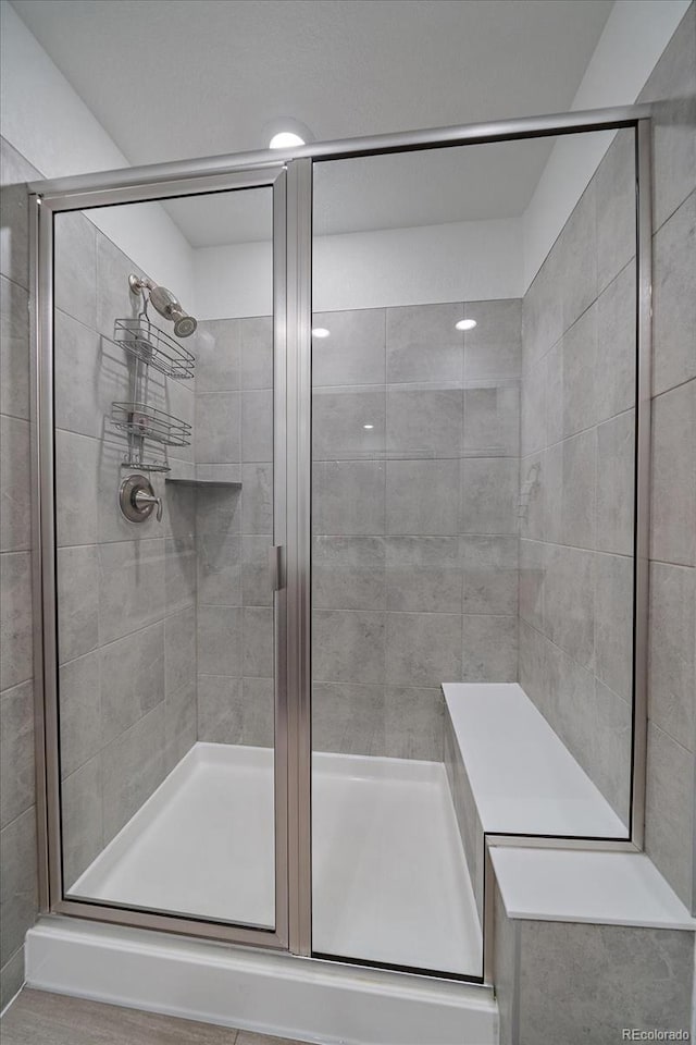 full bathroom featuring a stall shower