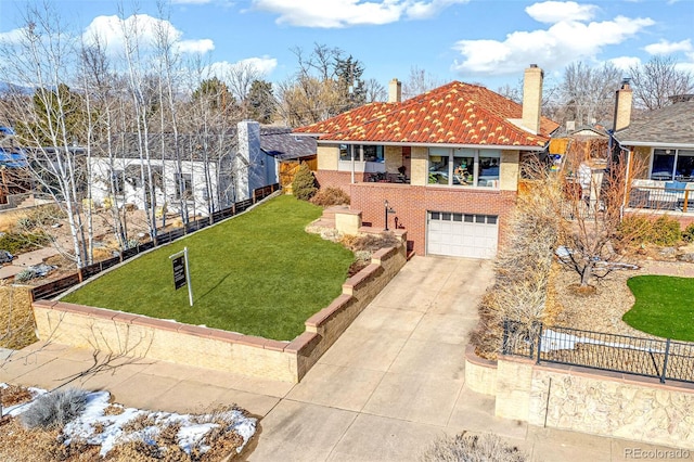 view of front facade with a garage and a front lawn