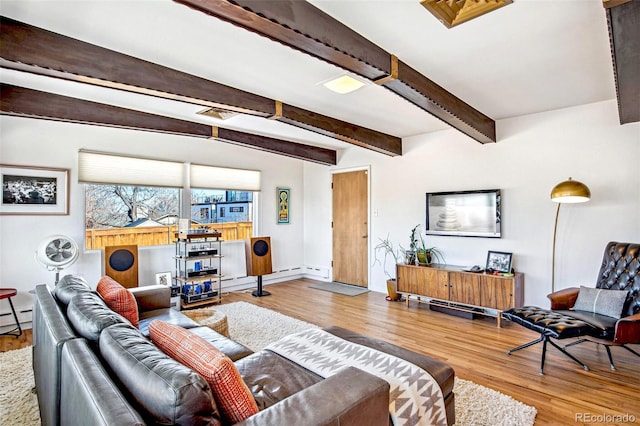 living room featuring beamed ceiling and wood-type flooring