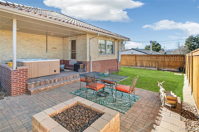 view of patio featuring a fenced backyard and a hot tub