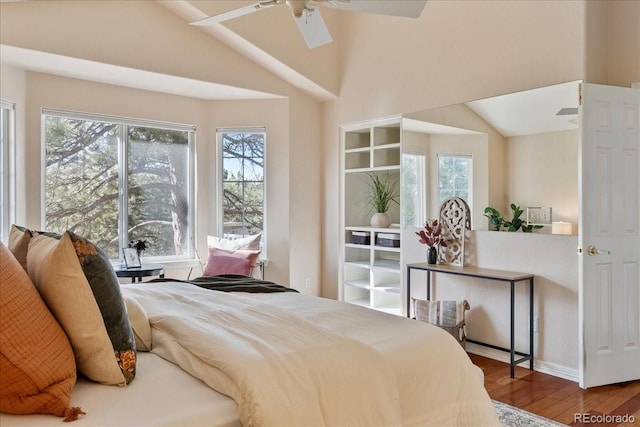 bedroom featuring lofted ceiling, ceiling fan, and wood finished floors