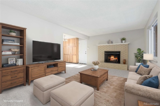 carpeted living room featuring a chandelier, a textured ceiling, and a brick fireplace