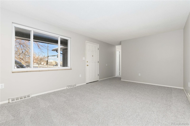 spare room featuring carpet floors