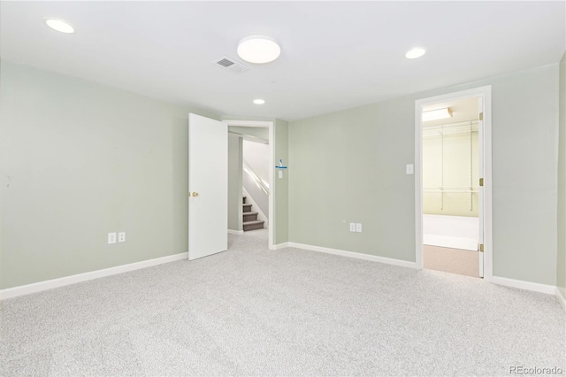 empty room featuring light colored carpet