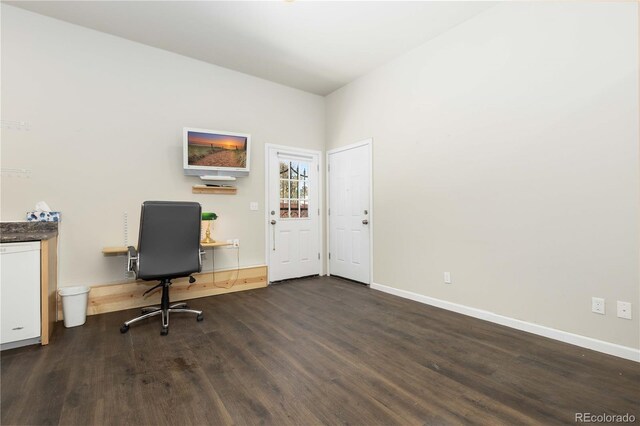 unfurnished office with dark hardwood / wood-style floors