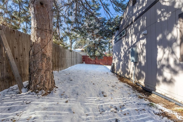 view of yard layered in snow