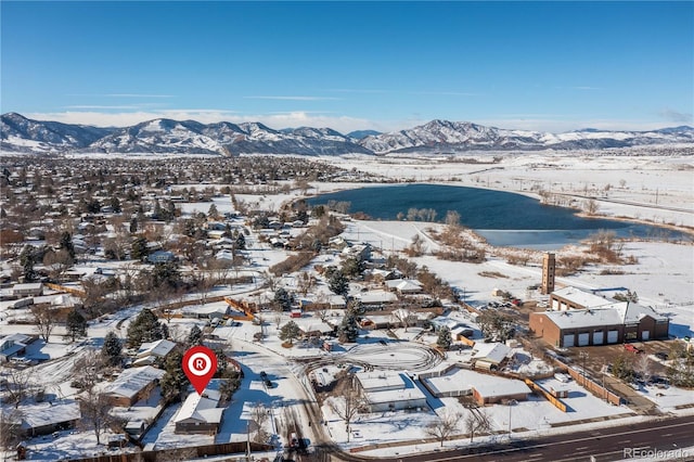 snowy aerial view with a mountain view