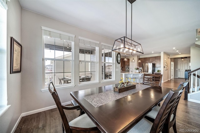 dining space with recessed lighting, baseboards, dark wood-style flooring, and stairs