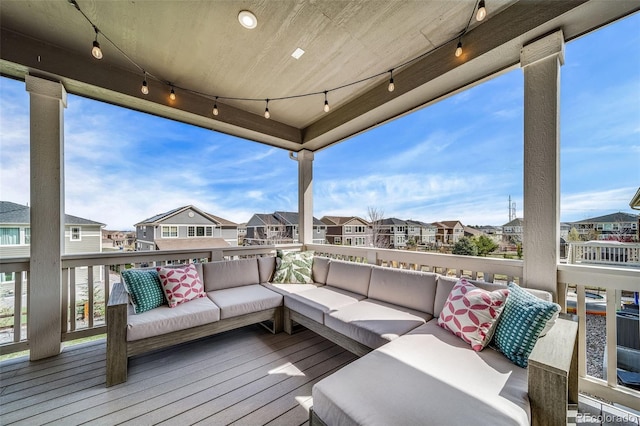 wooden deck featuring outdoor lounge area and a residential view