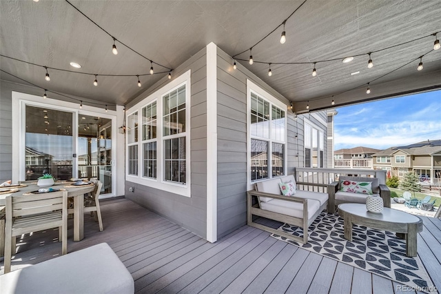 wooden terrace featuring an outdoor living space