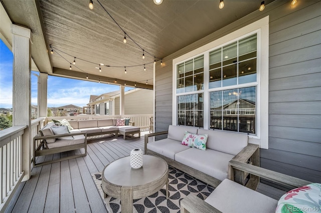 wooden terrace featuring outdoor lounge area
