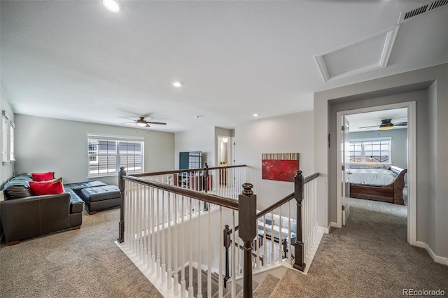 hall featuring carpet flooring, attic access, recessed lighting, an upstairs landing, and visible vents