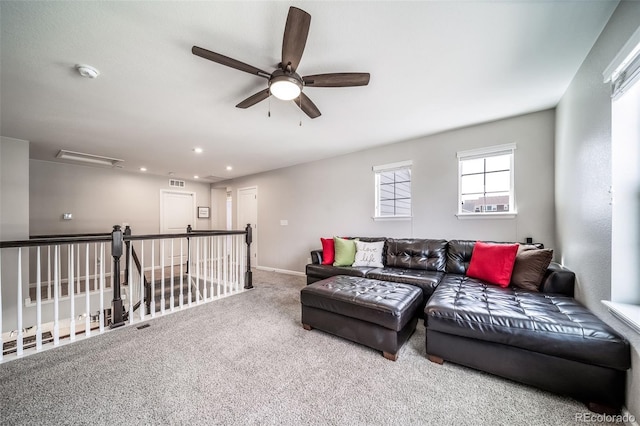 carpeted living area with baseboards, ceiling fan, recessed lighting, and visible vents