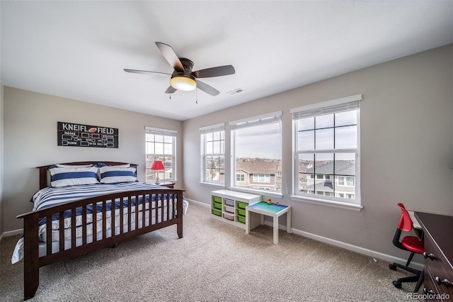bedroom featuring visible vents, a ceiling fan, carpet, and baseboards