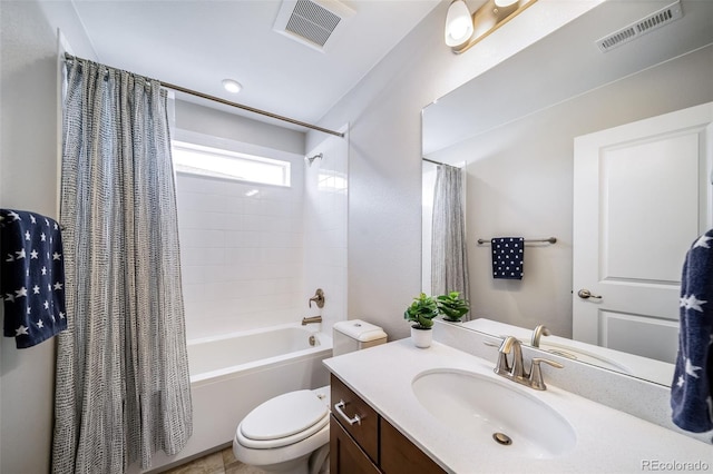 full bathroom featuring visible vents, shower / bath combo, toilet, and vanity
