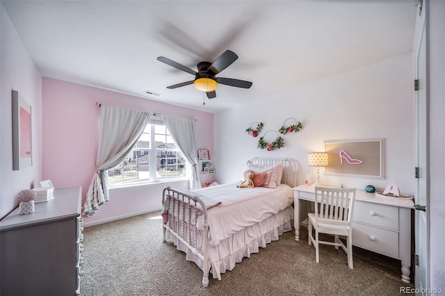 carpeted bedroom featuring baseboards, ceiling fan, and visible vents