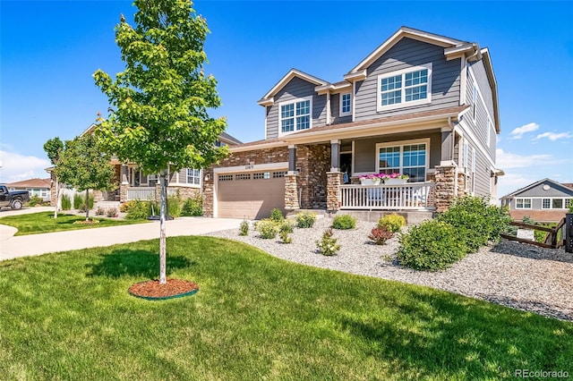 23879 E Narrowleaf Pl, Aurora, CO 80016 - craftsman house featuring a porch, a front yard, driveway, and stone siding