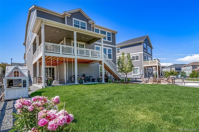 23879 E Narrowleaf Pl, Aurora, CO 80016 - back of house with a patio, a lawn, and a deck