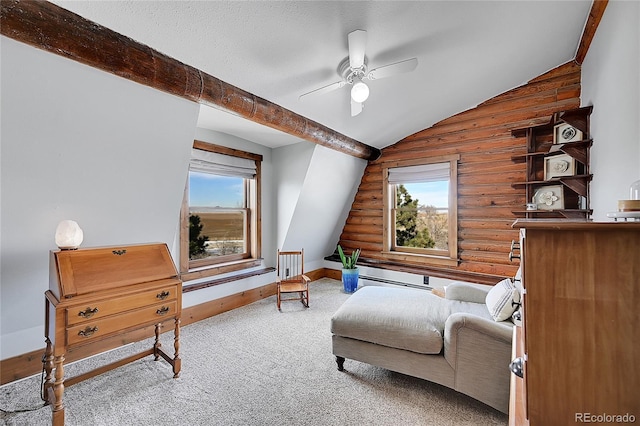 sitting room with vaulted ceiling with beams, a textured ceiling, carpet flooring, ceiling fan, and log walls