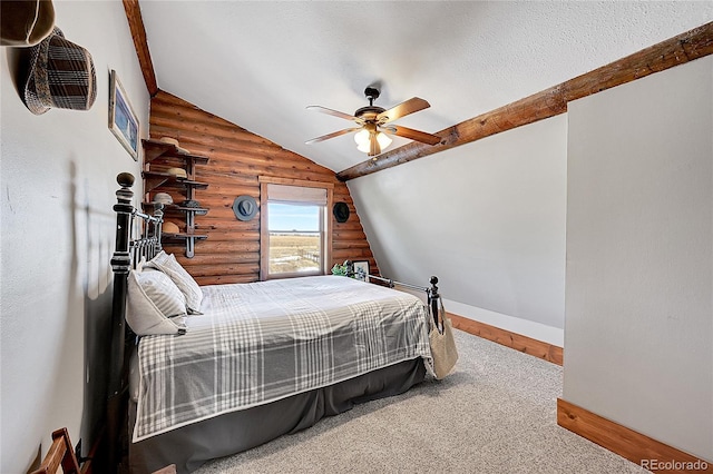 bedroom with lofted ceiling, ceiling fan, rustic walls, and a textured ceiling