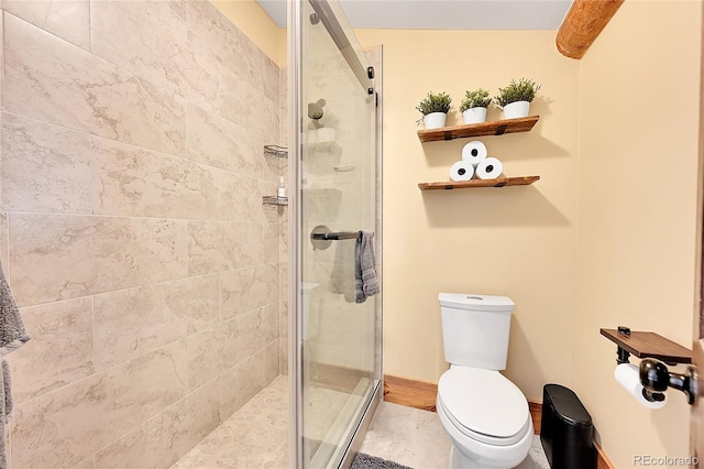 bathroom featuring walk in shower and toilet